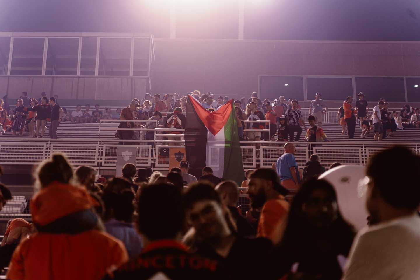 palestinian flag hanging over barriers in Princeton stadium